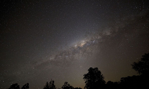 milky way galaxy seen from a distant moon