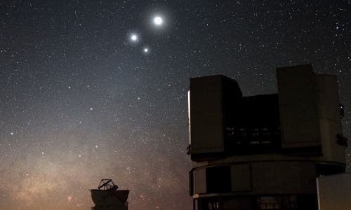 The Moon in conjunction with Venus and Jupiter, with the Very Large Telescope in the foreground. Image © Y. Beletsky, ESO, 2009.
